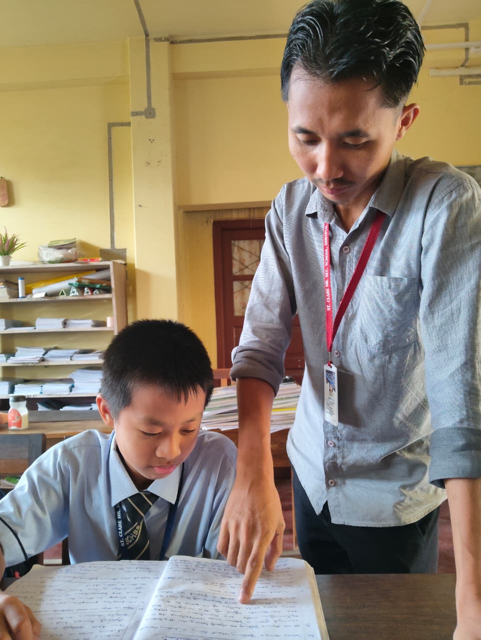 Teacher showing students lessons
